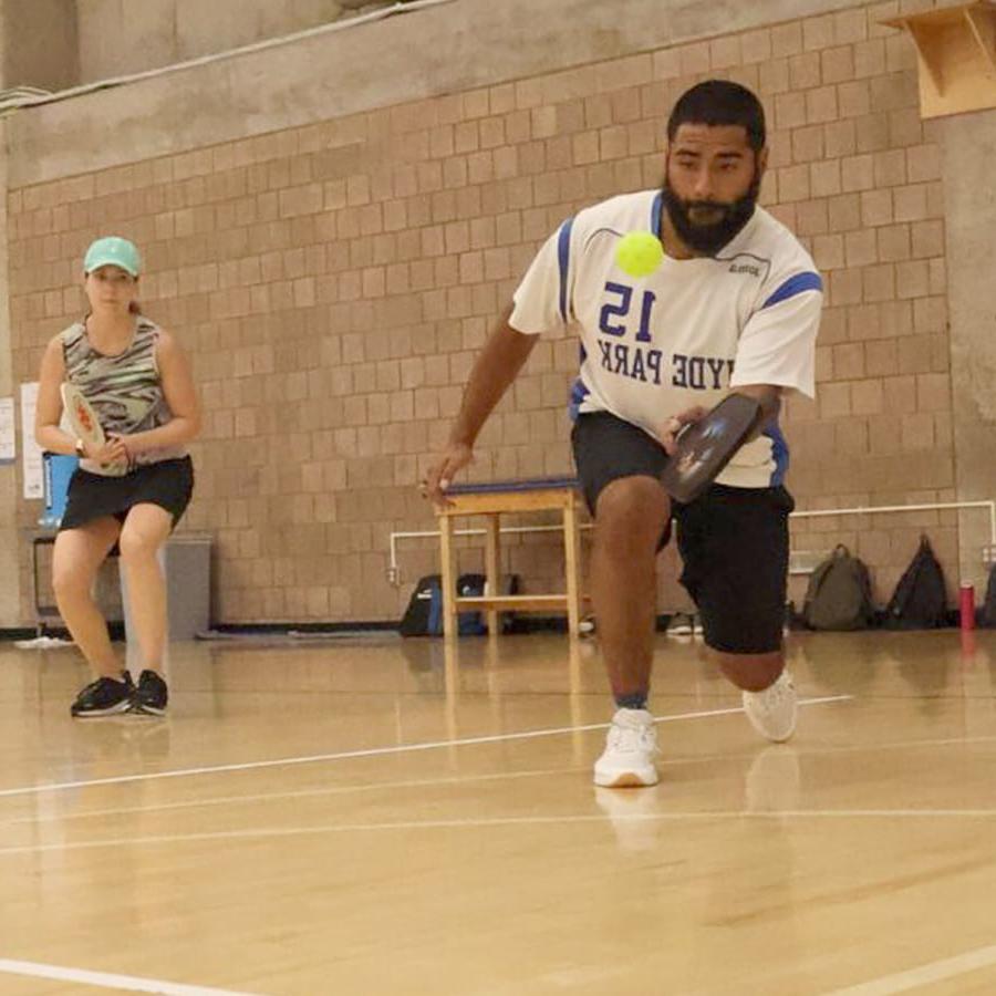 staff play pickleball.